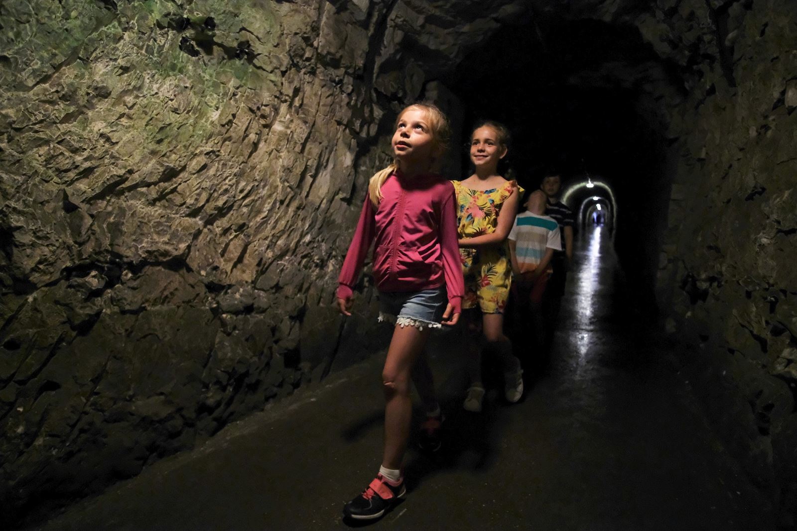 Children exploring the Fort Nelson tunnels